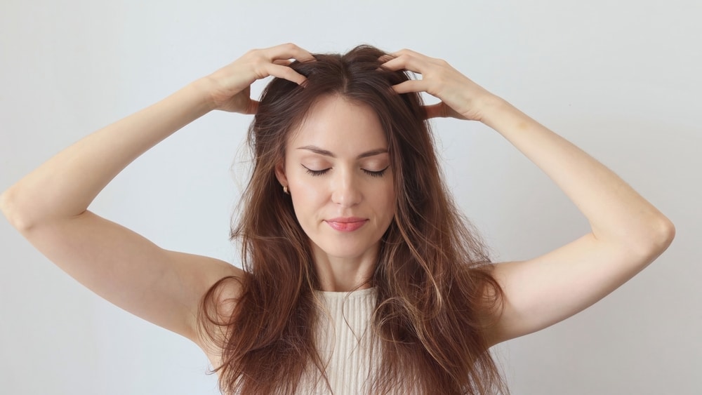 Illustration showing correct scalp massage technique to improve blood circulation and boost hair growth